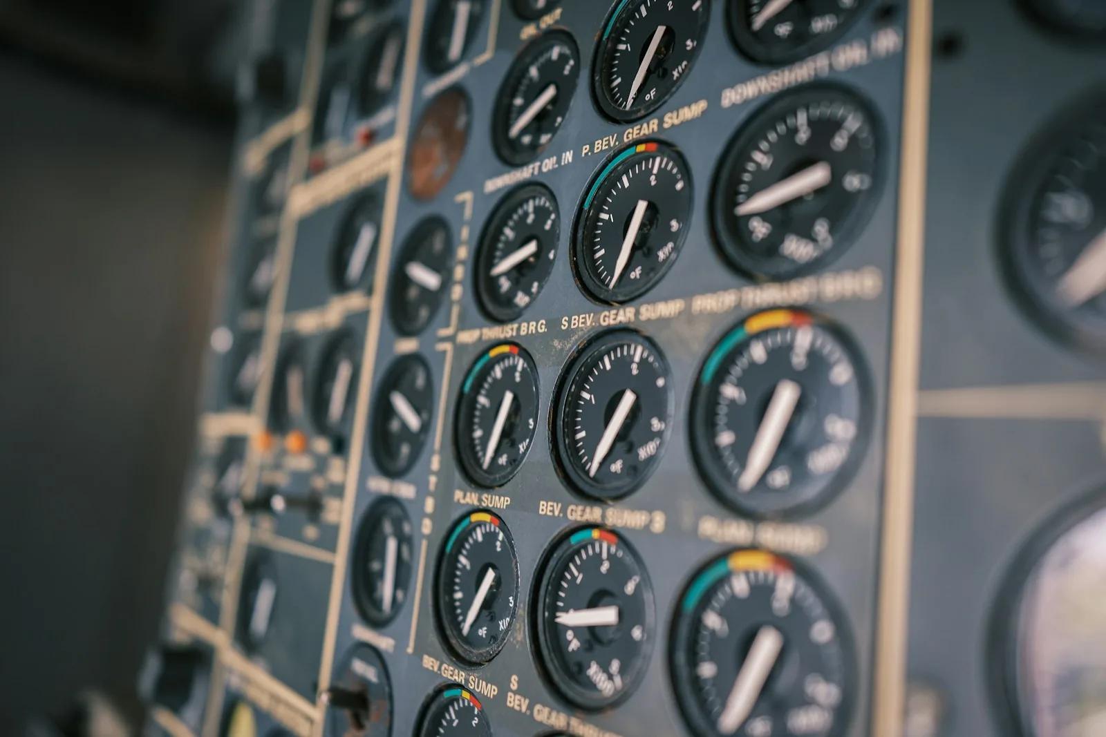 Close-up of an analog aircraft cockpit instrument panel — engine and gear-sump gauges.