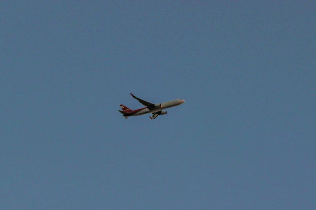 Let L-410 regional turboprop against a Dubai aviation backdrop.
